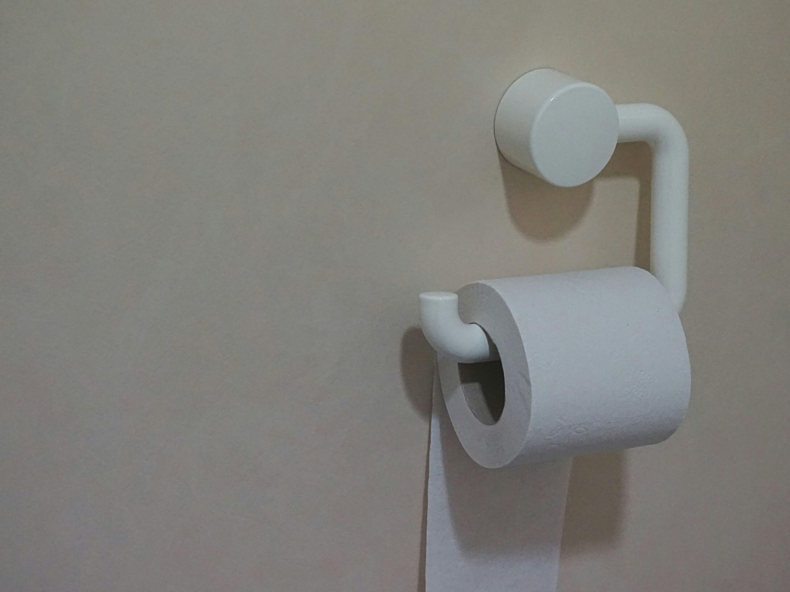 free falling toilet paper rack